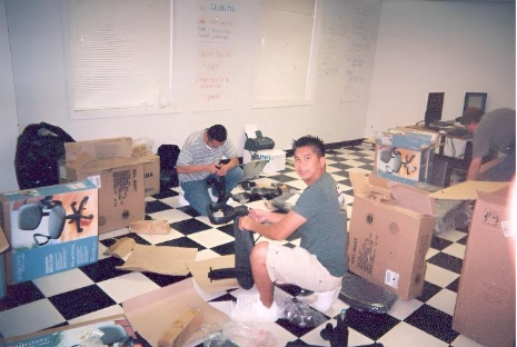 A group of men sitting on the floor

AI-generated content may be incorrect.